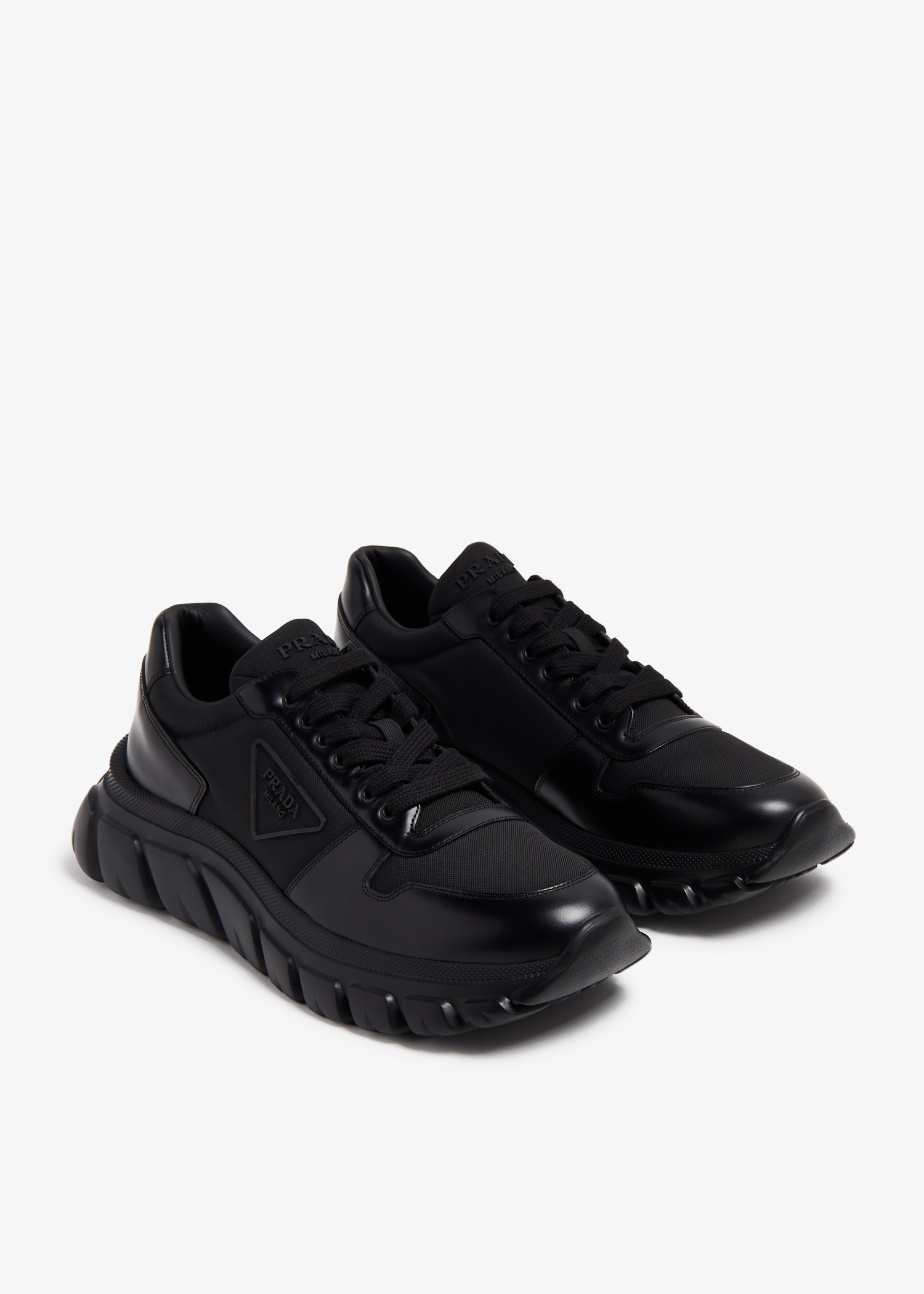 Prada Re-Nylon and brushed leather sneakers for Men - Black in UAE 