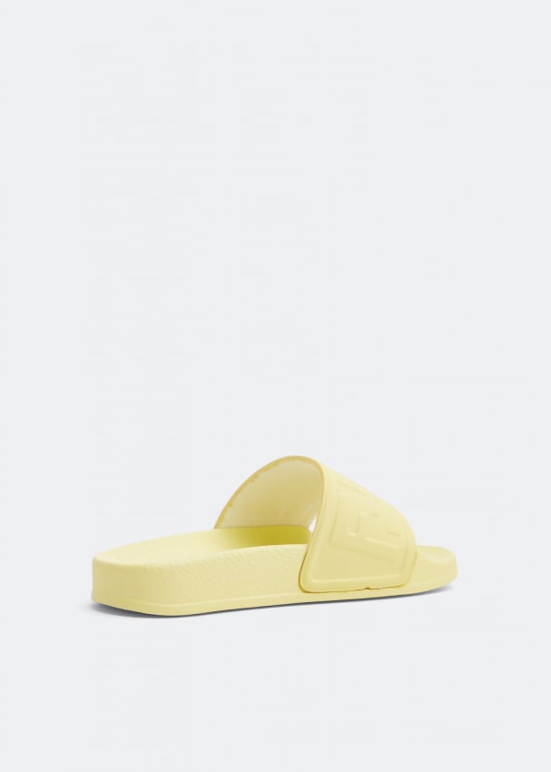 Fendi Logo rubber slides for Unisex - Yellow in UAE | Level Shoes