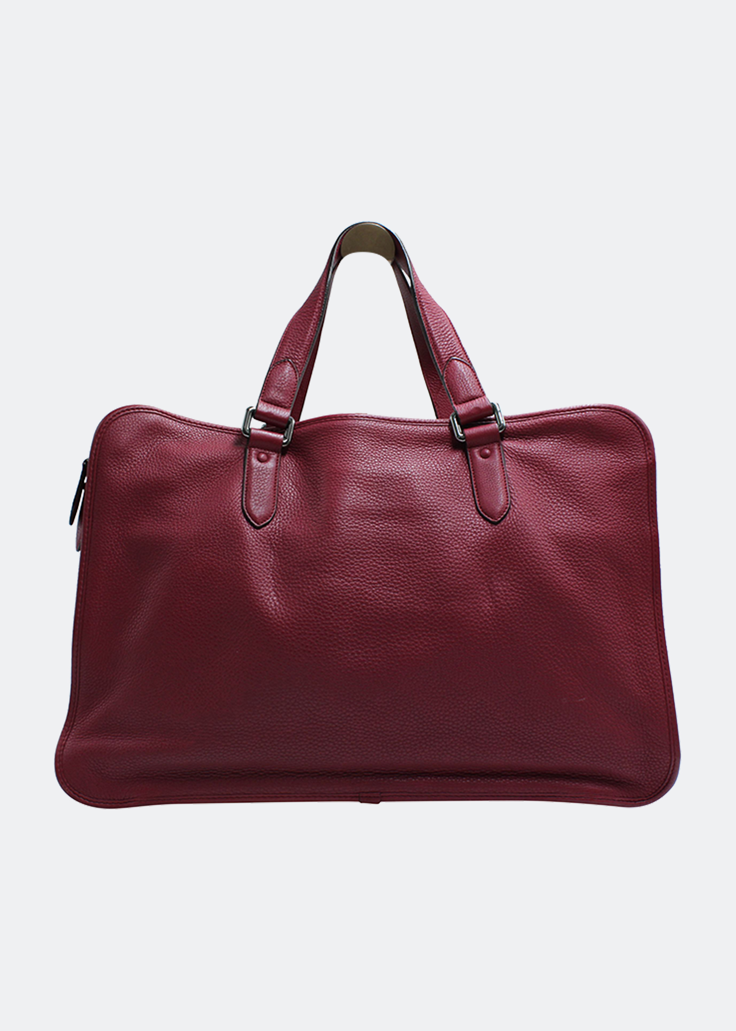 

Luggage bag with strap in red leather